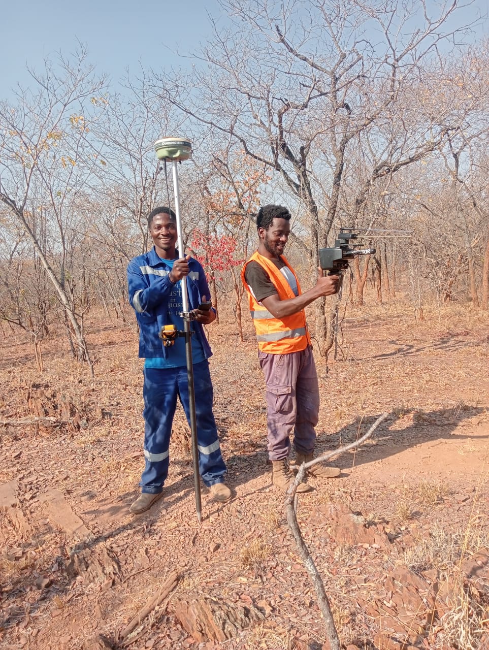 NECTAR field crew pegging a claim with a GNSS rover and handheld sensor